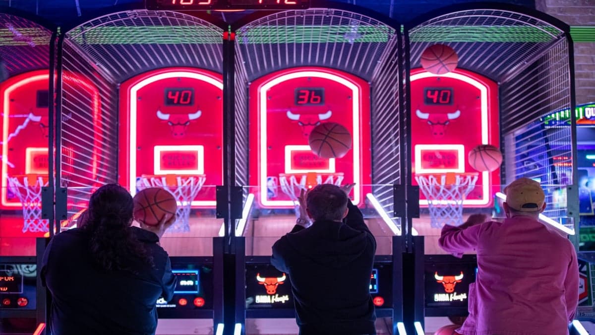 Guests competing at head-to-head arcade games at Ignite Arcade.