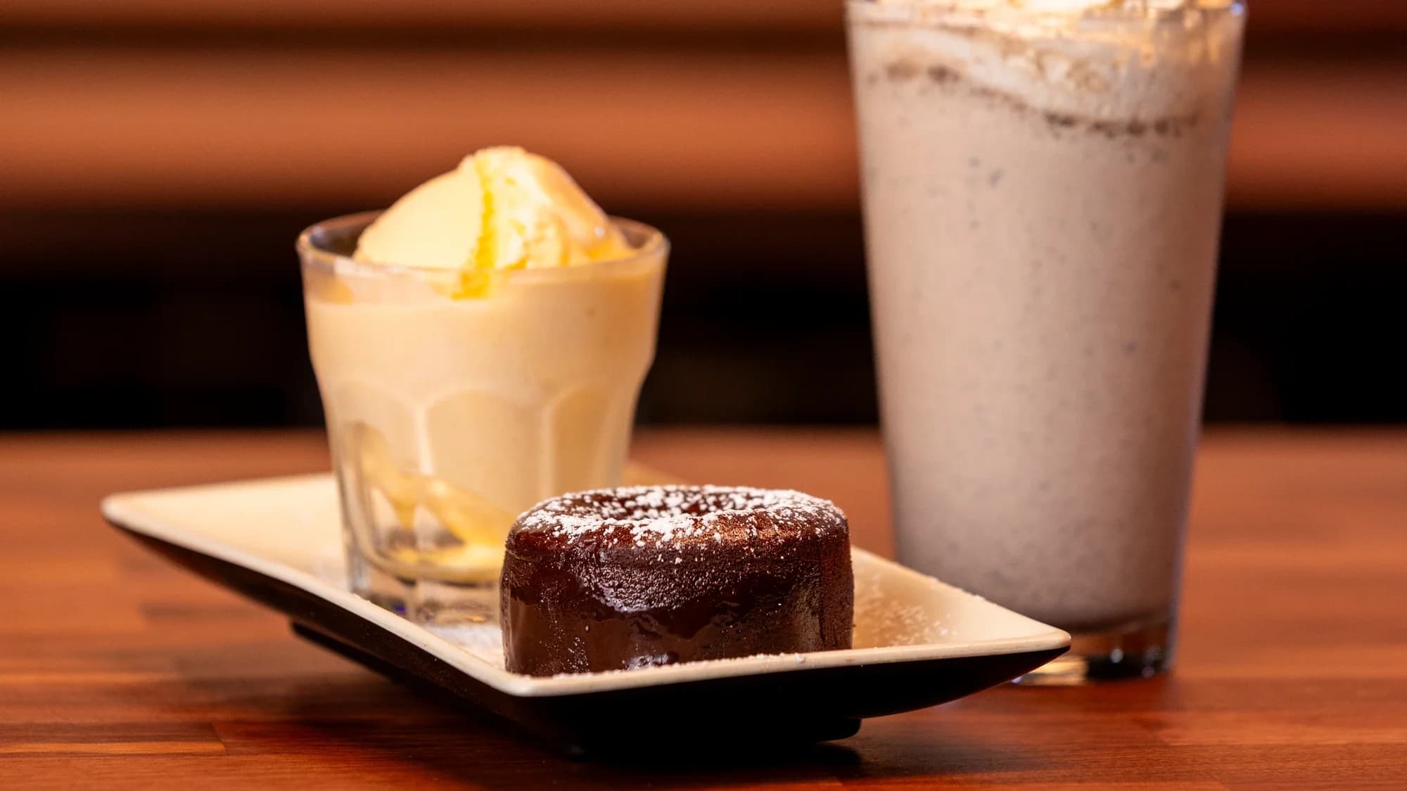 Chocolate lava cake, vanilla ice cream, and a milkshake at Ignite Arcade.
